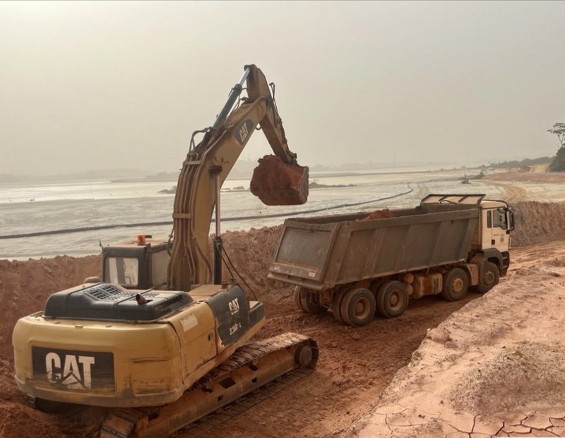 Compacting a tailings dam embankment